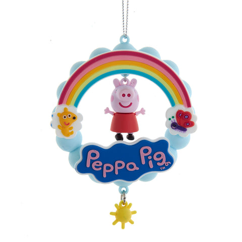 Peppa Pig Rainbow ornament with Peppa hanging below a colorful rainbow, blue clouds, butterfly detail, smiling sun, and yellow sun charm.