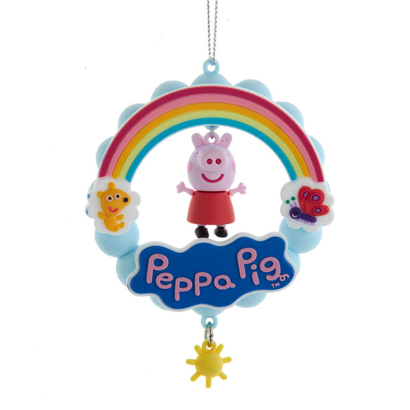 Peppa Pig Rainbow ornament with Peppa hanging below a colorful rainbow, blue clouds, butterfly detail, smiling sun, and yellow sun charm.