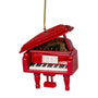 Red grand piano ornament with open lid, keys, and sheet music details