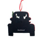 Black dachshund-shaped ornament with red accents on a white background