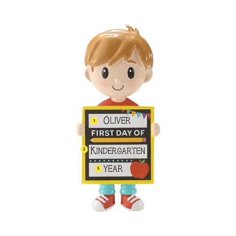 Personalized first day of school boy ornament with a name, grade, and year written on the school sign.