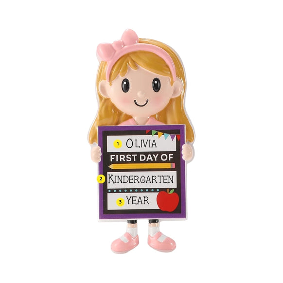 Personalized first day of school girl ornament with a name, grade, and year written on the school sign.