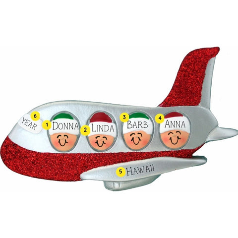 Airplane ornament with faces representing people, personalized with names and year and destination on a white background