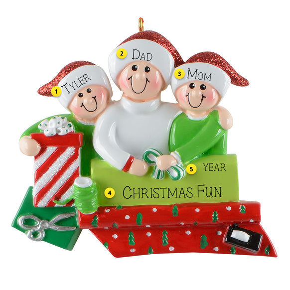 Personalized Christmas ornament with three people and decorative elements on a white background