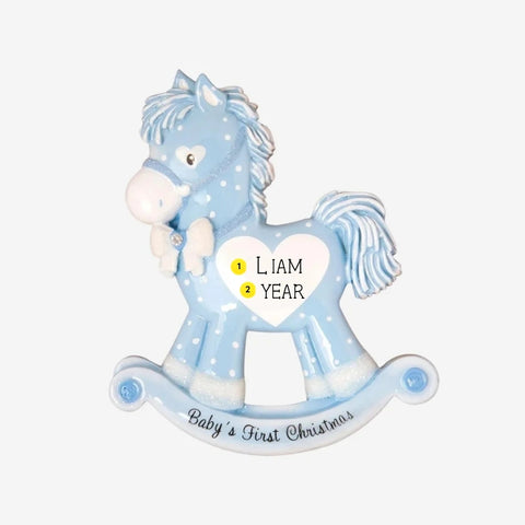 Personalized baby boy’s first Christmas blue rocking horse ornament with a name and year added to the white heart on the side.