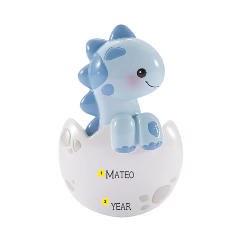 Personalized blue baby brontosaurus ornament in a cracked white egg with name and year placement shown.