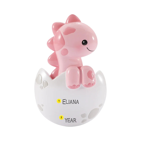 Personalized pink baby brontosaurus ornament in a cracked white egg with name and year placement shown.