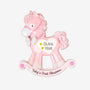 Personalized baby girl’s first Christmas pink rocking horse ornament with a name and year added to the white heart on the side.