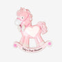 Baby girl’s first Christmas pink rocking horse ornament with white polka dots, a bow, a white heart, and printed text on the rocker.