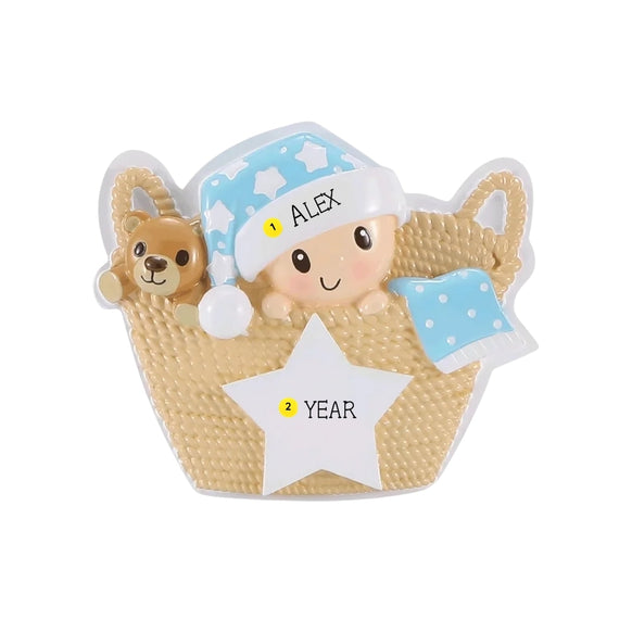 Personalized baby in a basket ornament with a name on the hat and space for a year on the white star.