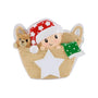 Baby in a basket ornament with red star pajamas, green blanket, teddy bear, and white star on the front.
