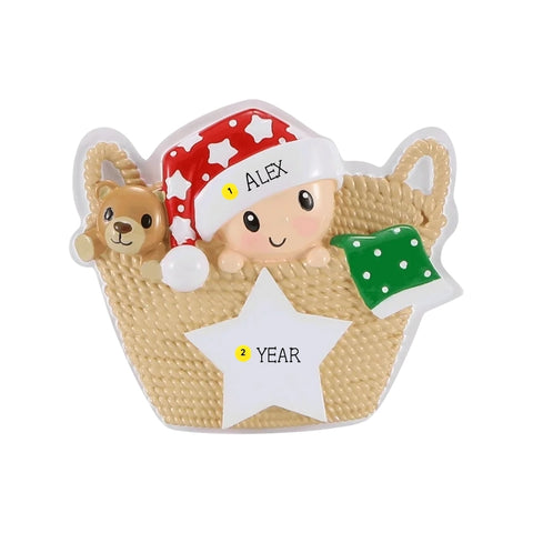 Personalized baby in a basket ornament with a name on the hat and space for a year on the white star.