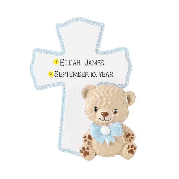 Personalized baby blue cross ornament with a child’s name and date added above a plush teddy bear with a blue bow.