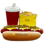 Hot dog with toppings, cup, and bag of chips on a white background