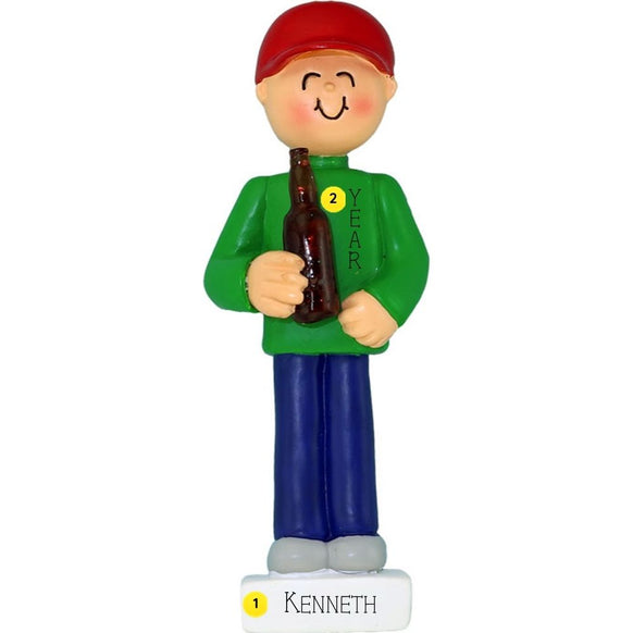 Ornament of a person wearing a red cap personalized with name and year, holding a beer bottle, on a white background.