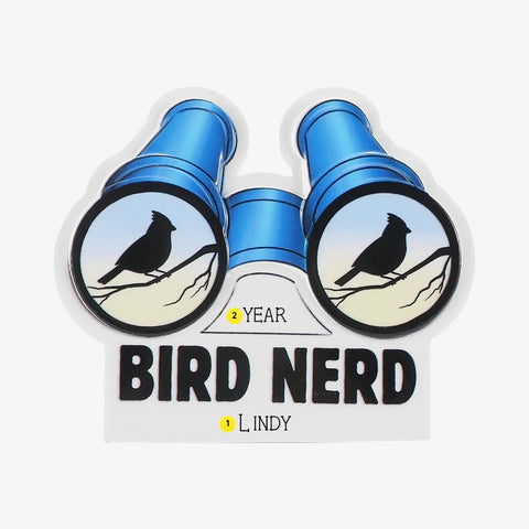 Personalized birding ornament with a name below the “Bird Nerd” lettering and the year on the binoculars.