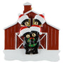 Black bear family of 4 ornament with Christmas hats and a wreath in front of a red barn.
