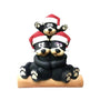 Black bear family of 3 tabletop decoration with a cuddling bear couple on a log and one cub above them, all wearing Santa hats.