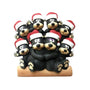 Black bear family of 8 tabletop decoration with a cuddling bear couple on a log and six cubs gathered around them, all wearing Santa hats.