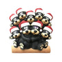 Black bear family of 9 tabletop decoration with a cuddling bear couple on a log and seven cubs gathered around them, all wearing Santa hats.