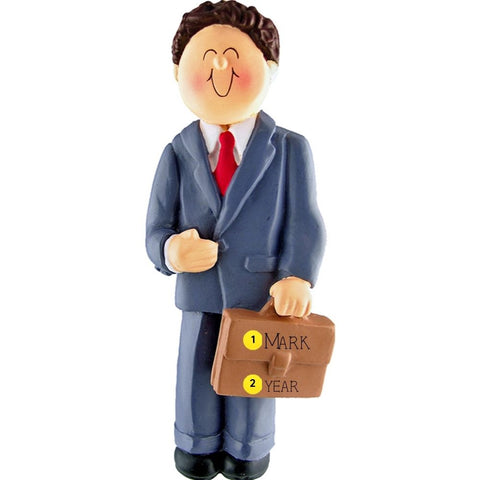 Ornament of a man in a suit holding a briefcase personalized with name and year, on a white background.