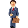 Ornament of a man in a suit holding a briefcase on a white background