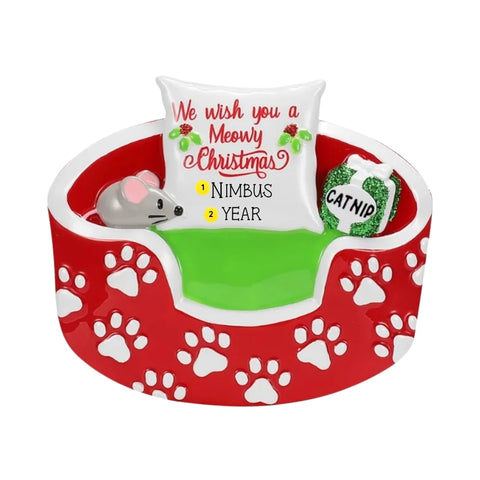 Personalized Christmas cat bed ornament with a pet name and year on the pillow.