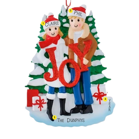Personalized JOY couple ornament with names on the hats, a family name on the base, and space for a year.
