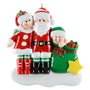 Christmas ornament featuring a family of three in festive clothing on a white background