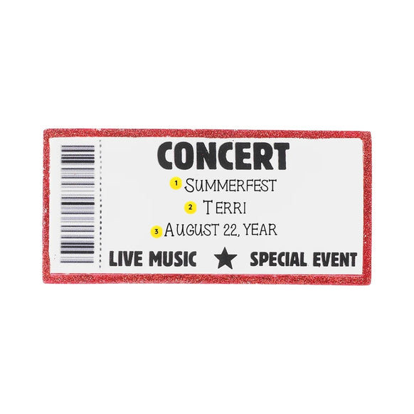 Personalized concert ticket ornament with an event name, attendee name, and concert date written on the ticket.