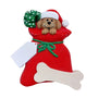 Dog in a red bag with green bows on a white background