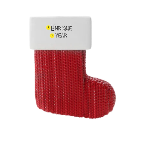 Personalized farmhouse cable knit stocking ornament with a name and year written on the white cuff.
