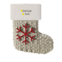Personalized farmhouse snowflake stocking ornament with a name and year written on the white cuff.