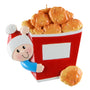 Decorative ornament of a boy with a red container with chicken nuggets on a white background