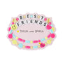 Personalized best friends ornament with two names in the center and the year written on a pink heart charm.