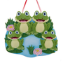 Frog pond family of four ornament with four smiling frogs, lily pads, reeds, and pink water lilies.
