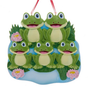 Frog pond family of five ornament with five smiling frogs, lily pads, reeds, and pink water lilies.