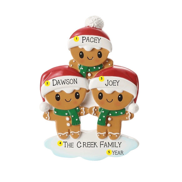 Personalized gingerbread family of three ornament with names on the Santa hat brims, a family name or phrase on the snowy base, and the year added near the bottom.