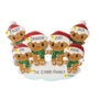 Personalized gingerbread family of six ornament with names on the Santa hat brims, a family name or phrase on the snowy base, and the year added near the bottom.
