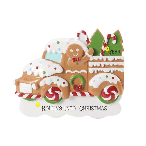 Personalized gingerbread truck ornament with a holiday phrase on the snow base and year added near the Christmas trees.