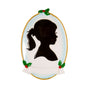 Girl silhouette Christmas ornament with a black profile, ponytail, gold oval trim, blue shading, holly accents, and blank white banner.