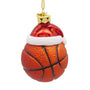 Glass basketball Christmas ornament with orange basketball design, black lines, red Santa hat, white glitter trim, and gold hanging cord.