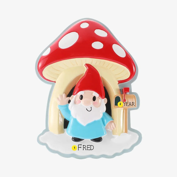 Personalized gnome and mushroom house ornament with a name written on the snowy base and a year added to the mailbox.