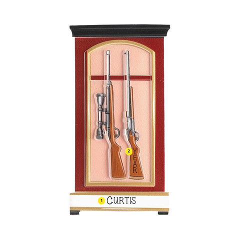 Personalized gun case ornament with a name on the base and the year written on the rifle stock.