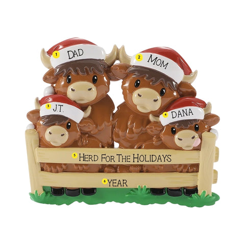 Personalized Highland cow family ornament with names on the Santa hats, a holiday phrase on the fence, and year below.