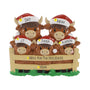 Personalized Highland cow family ornament with names on the Santa hats, a holiday phrase on the fence, and year below.