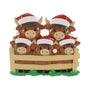 Highland cow family ornament with five cows in Santa hats standing behind a fence.
