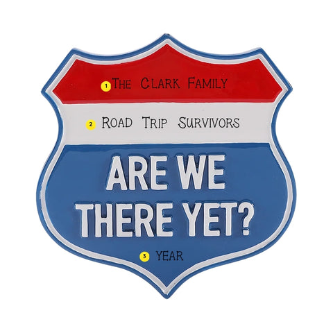 Personalized highway road trip sign ornament with a family name, road trip phrase, and year written on the sign.