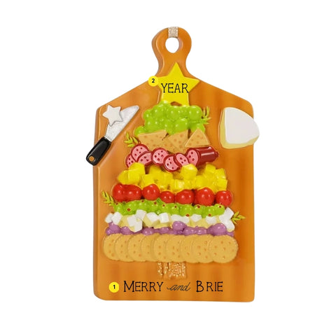 Personalized holiday charcuterie board ornament with a short phrase on the board and space for a year on the star topper.