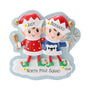 Two Christmas elves ornament personalized with two names on the hats, a short phrase on the snowy base, and a year.